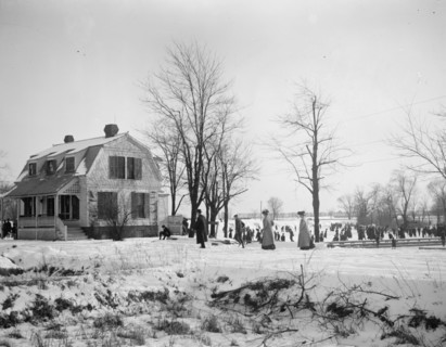 Skating on the basin on a cold winter day ca. between 1909 and 1923