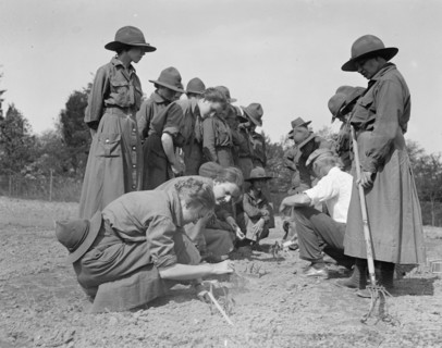 National Women's Defense League Camp: women planting seeds in a garden ca. between 1909 and 1923
