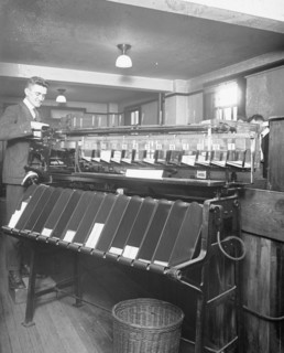 Man working a sorting machine at the U.S. Census Bureau ca. between 1909 and 1940