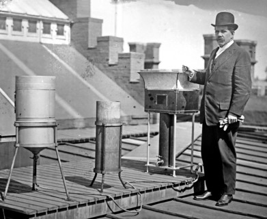 Marvin, Chief of Weather Bureau, on roof with weather instruments ca. between 1909 and 1919
