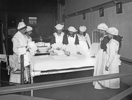 Red Cross education, nurses and students during a home hygiene class, C.H.S. ca. between 1909 and 1940