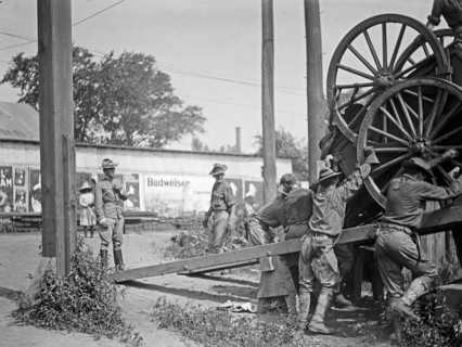 U.S. Army, transportation of equipment & troops, loading or unloading equipment ca. between 1909 and 1940