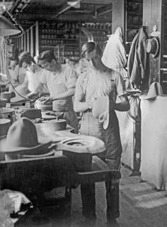 Men working at the Stetson Hat Company manufacturing soft army hats ca. between 1909 and 1920