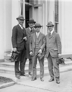 Photographers with cameras on steps ca. between 1909 and 1923