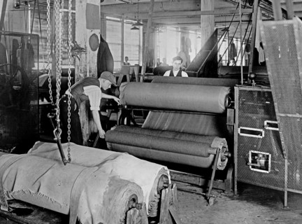 Workers manufacturing of cloth for army uniforms ca. between 1909 and 1920