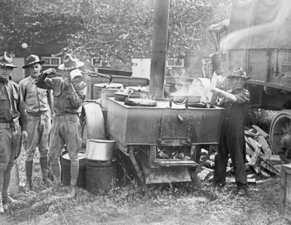 Soldiers cooking food at a army field kitchen, 1st Division boys ca. between 1909 and 1932