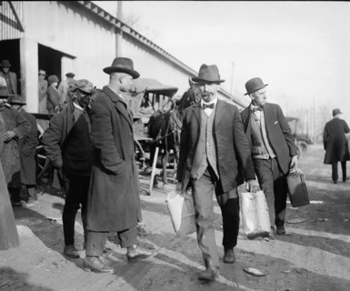Men carrying packages of whiskey ca.  between 1918 and 1920