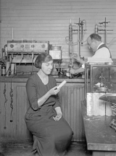 Man and woman in laboratory performing duties to obtain sugar from corn ca.  between 1918 and 1921