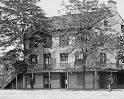 African American man walking across the street in SW Washington, D.C. ca.  between 1918 and 1920
