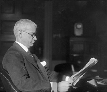 American banker R.C. Leffingwell reading papers ca.  between 1918 and 1920