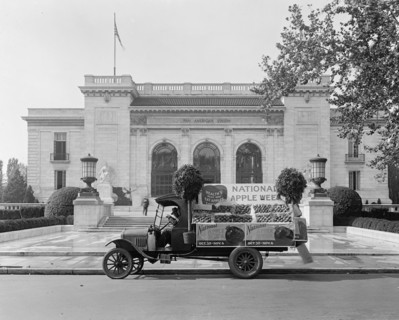 National Apple Week Association float [Pan American Union, Washington, D.C. in background] ca.  between 1918 and 1928