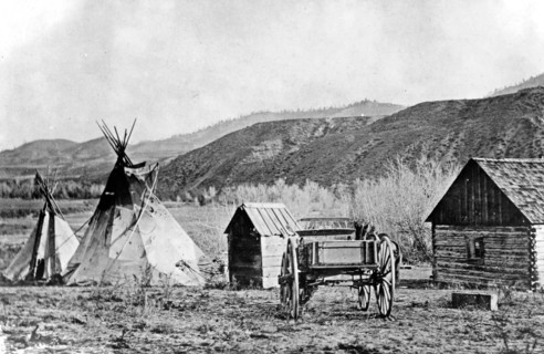 A building and a teepee at the Colville agency, Colville Indian Reservation ca. 1909
