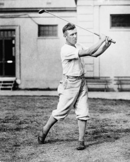 Man swinging golf club in the Washington, D.C., area ca. 1909