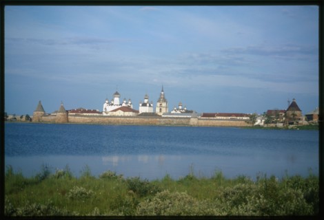 Monastery of the Transfiguration of the Savior (16th-19th centuries), northeast view across Holy Lake, with White Tower (left), Arkhangelsk Tower, and St. Nicholas Tower (right), Solovetskii Island, R...