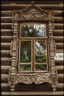 Log house, Nikitin Street #15 (at corner of Belinskii Street), (early 20th century), window on Belinskii Street facade, Tomsk, Russia; 1999