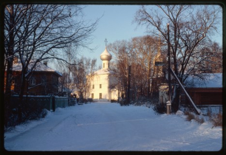 Church of Elijah the Prophet (1698), southeast view, with wooden houses on Zasodimskii street, Vologda, Russia 1997.