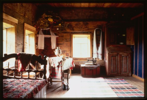 Igoshev house, from village of Gribany (mid-19th century), interior, main room, Khokhlovka, Russia 1999.