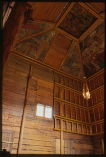 Log Church of the Prophet Elijah (1690-96), interior, northeast corner, with icon screen and ceiling paintings, Belozersk, Russia; 1999