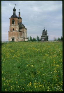 Church of Resurrection (1752), and log Church of St. George (1665), southwest view, Permogor'e, Russia; 2000