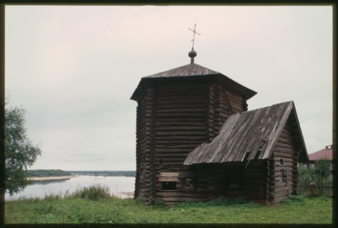 Log Church of the Epiphany (also known as Nativity of the Virgin), (1617), northwest view, with Kama River in background, Pianteg, Russia; 2000