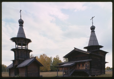 Log Church of the Savior and bell tower from the village of Zashiversk (1700), southwest view, moved and reassembled in the Outdoor Architecture and History Museum at Akademgorodok, Russia 1999.