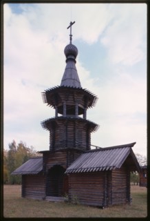 Log Church of the Savior from the village of Zashiversk (1700), bell tower, northeast view, moved and reassembled in the Outdoor Architecture and History Museum at Akademgorodok, Russia 1999.