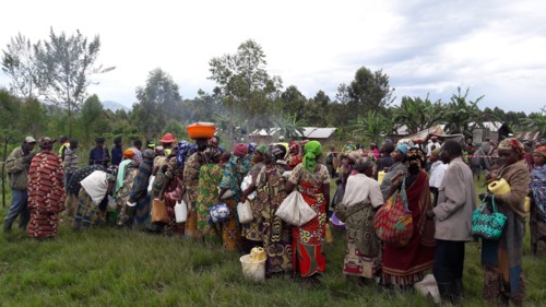 Women in colorful traditional dress wait for relief help during a crisis in North Kivu Cote d’Ivoire (Ivory Coast) ca. 22 March 2017