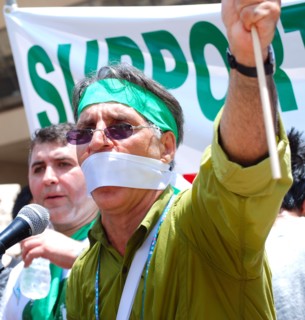 Iranians in Texas taking part in a Freedom for Iran / Green Revolution rally at Dallas City Hall plaza in downtown Dallas, TX ca. June 2009