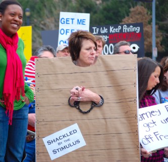Attendees holding signs at a Tea Party rally in Dallas, TX (one of the first in the United States on Feb. 26 2009)