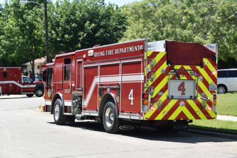 First responders; firemen and paramedics, help trapped construction worker trapped in a trench; Irving, TX USA