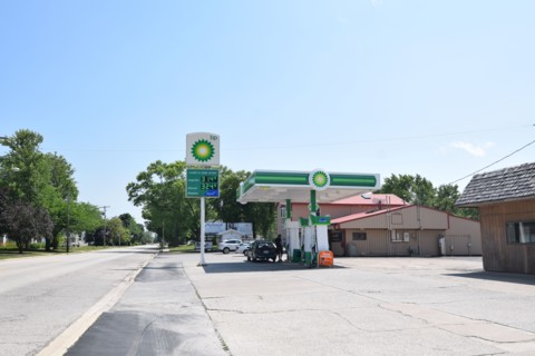 Customers pumping gas at the BP gas station in Cissna Park, Illinois