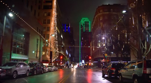 Office buildings and street scene in downtown Dallas at night during the Christmas season