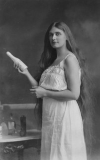 Early 20th-century Beauty with beauty products