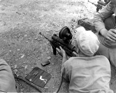 Marine firing a carbine, 1953