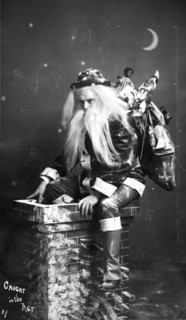 Creepy Santa climbing down a chimney