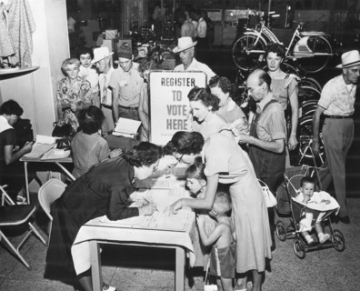 Lining up at a registration booth at Sears Roebuck store