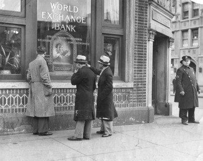 Police stand guard at the entrance to the World Exchange Bank