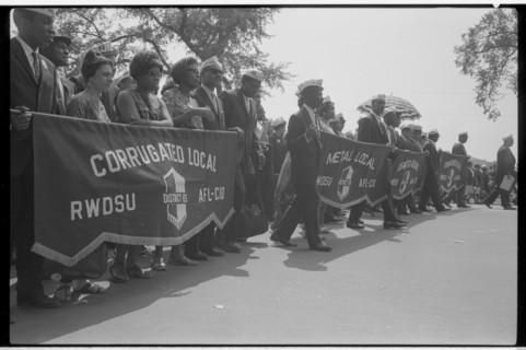 Marchers carrying labor union banners, 1963