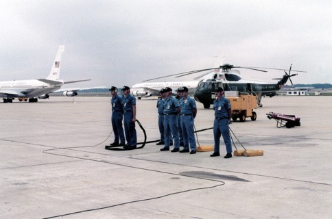An aircraft maintenance crew stands by as President Jimmy Carter returns from his European visit.