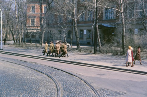 A group of Soviet soldiers carrying satchels and briefcases