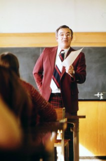 A Teacher Talks to His Students in a Classroom
