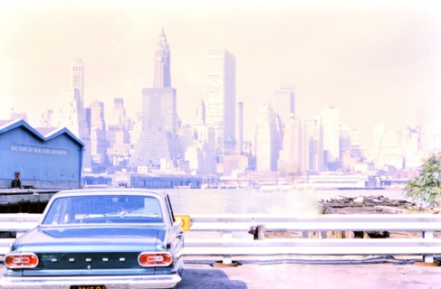 Car parked in front of New York City skyline ca. 1960s