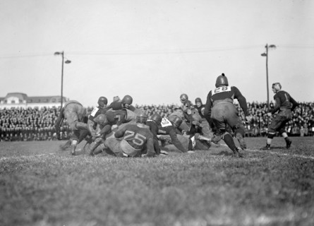 Early 1900s football game in action