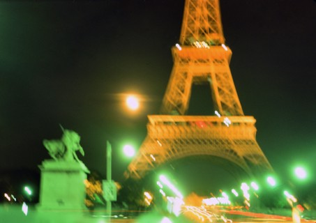 Early 1970s Blurred lights of Paris France at night at the Eifel Tower ca. 1974