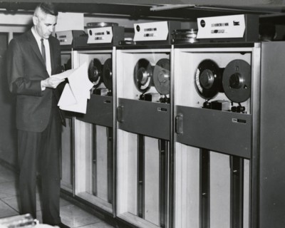 Edward Stone in front of an IBM Computer