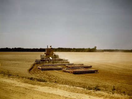 Harrowing a field with a diesel tractor