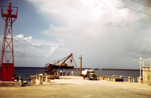Loading cargo on a freighter in the harbor of Frederiksted