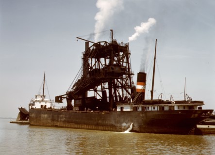 Loading coal into a freighter at one of the Pennsylvania Railroad docks