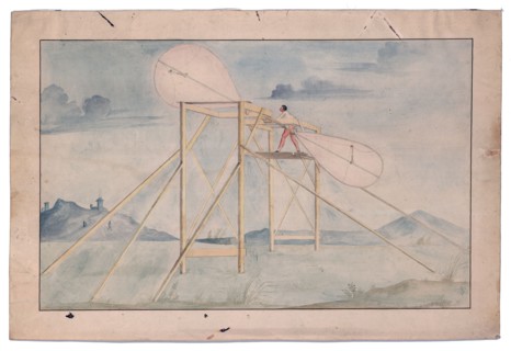 Man standing on a platform manipulating a set of paddle
