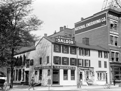 Man walking outside Mullany's Saloon
